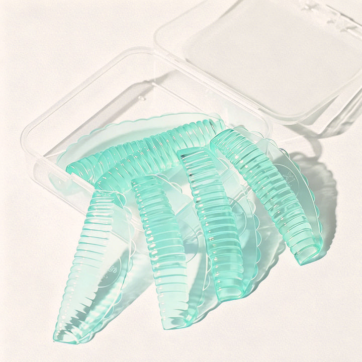 Professional reusable silicone lash lift pads in 4 sizes & 3 colors. Skin-friendly material with groove design for even curls, salon lash lift services.
